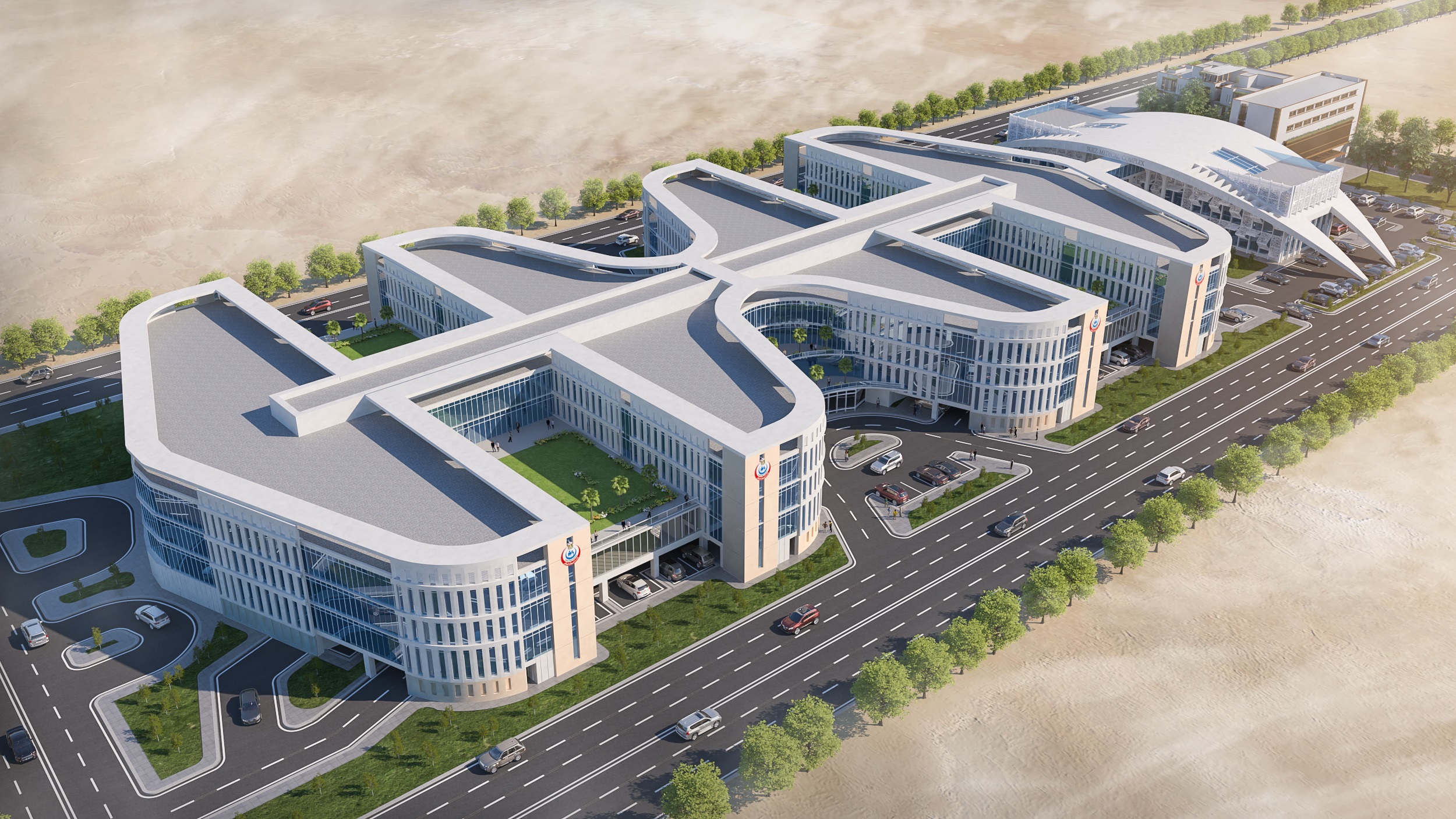 Aerial architectural rendering of the Suez Medical Complex showing curved building wings, landscaped courtyards, access roads and a wide main road.