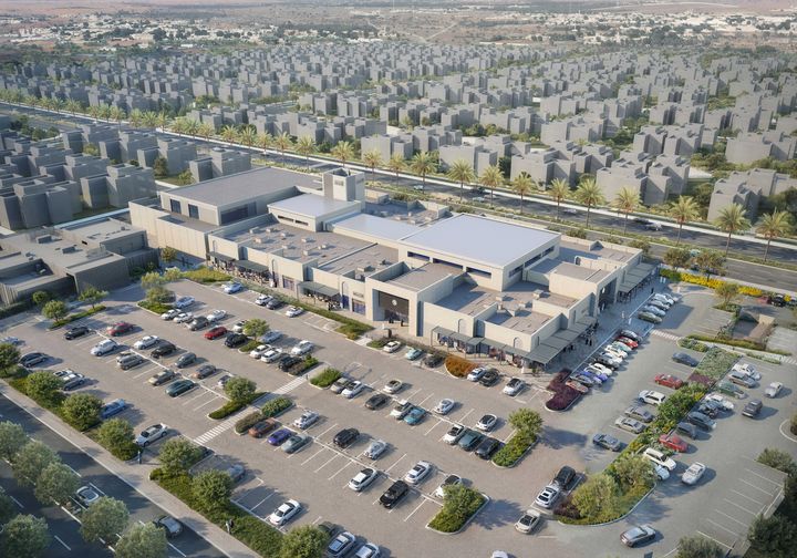 Aerial architectural visualisation of Al Danah Square, showing commercial buildings, car parks and adjoining residential neighbourhoods.