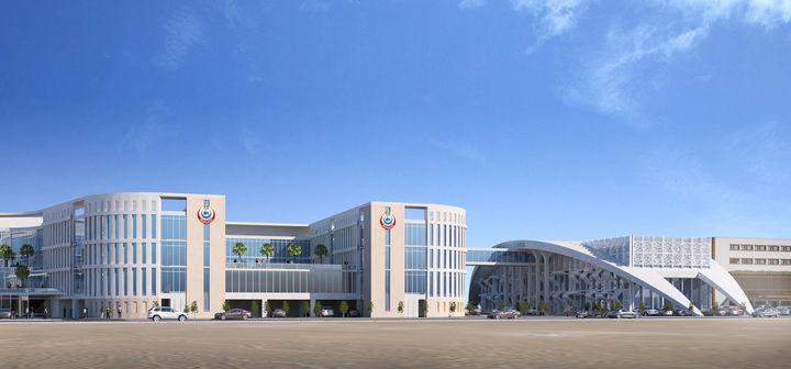 Architectural rendering of the Suez Medical Complex showing modern building wings, glass façades and a large arched canopy over the entrance.